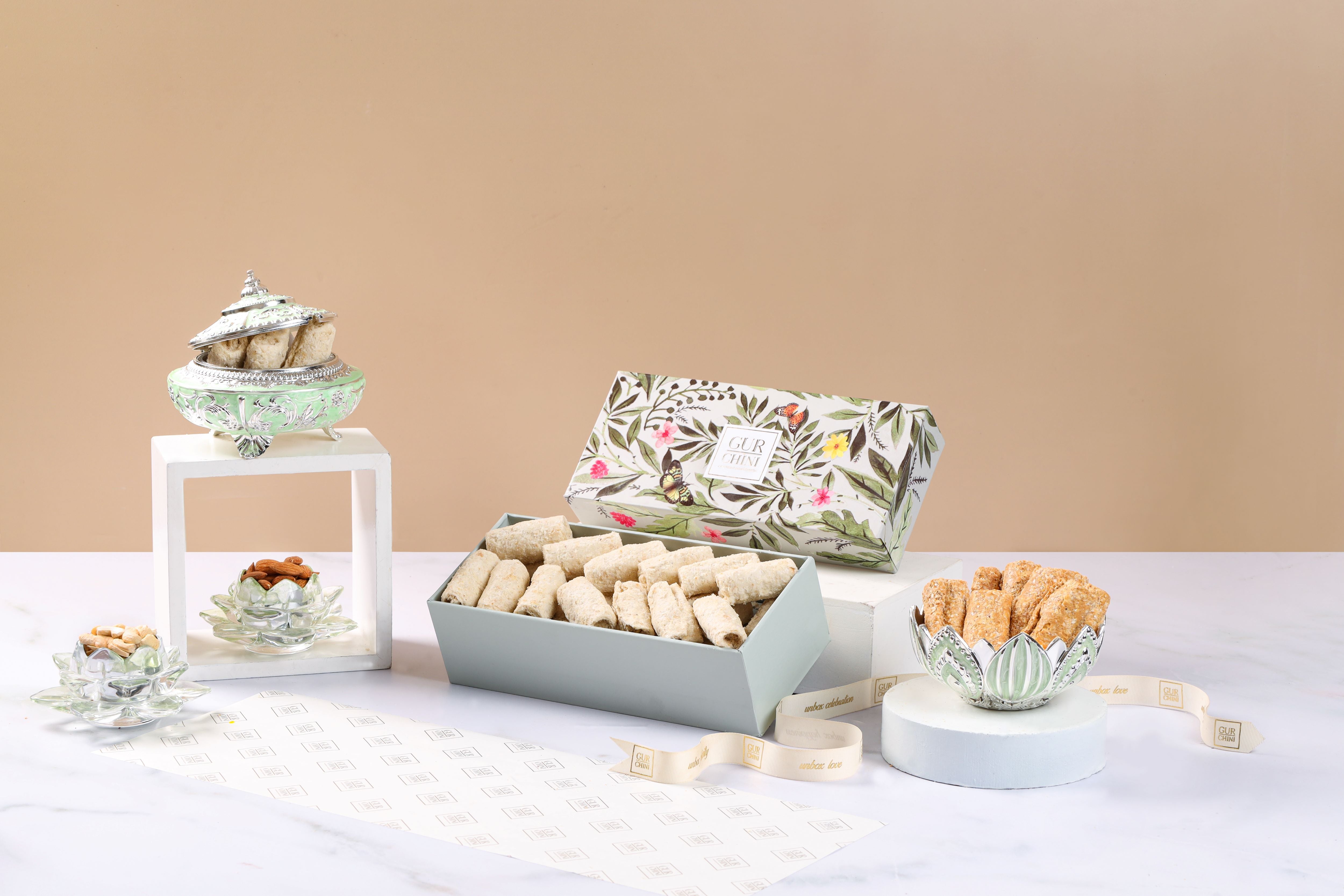 A Green Flower Box of Til Chini Rolls