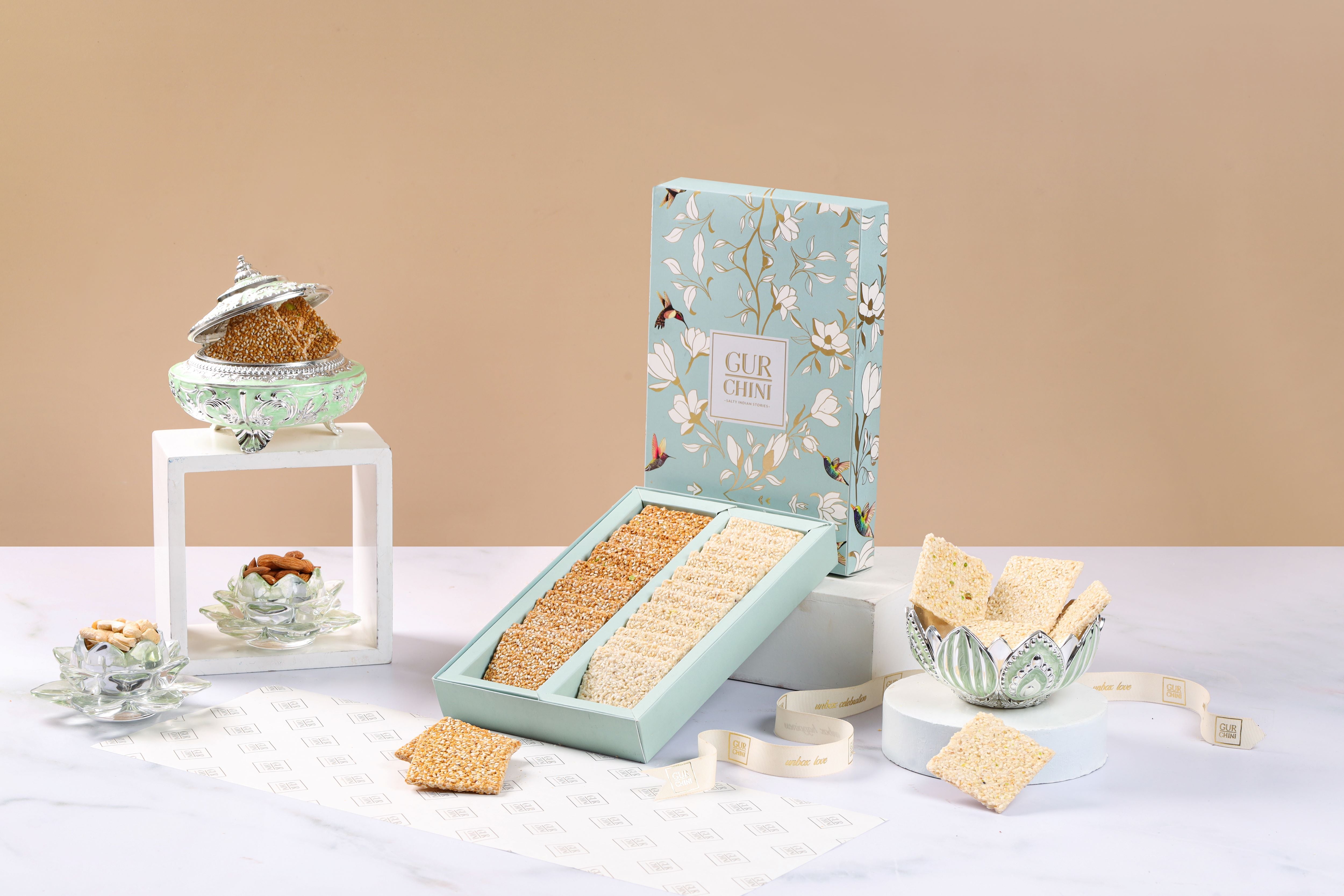 A Sky Blue Flower Box of Chini Till Patti & Til Gur Patti.