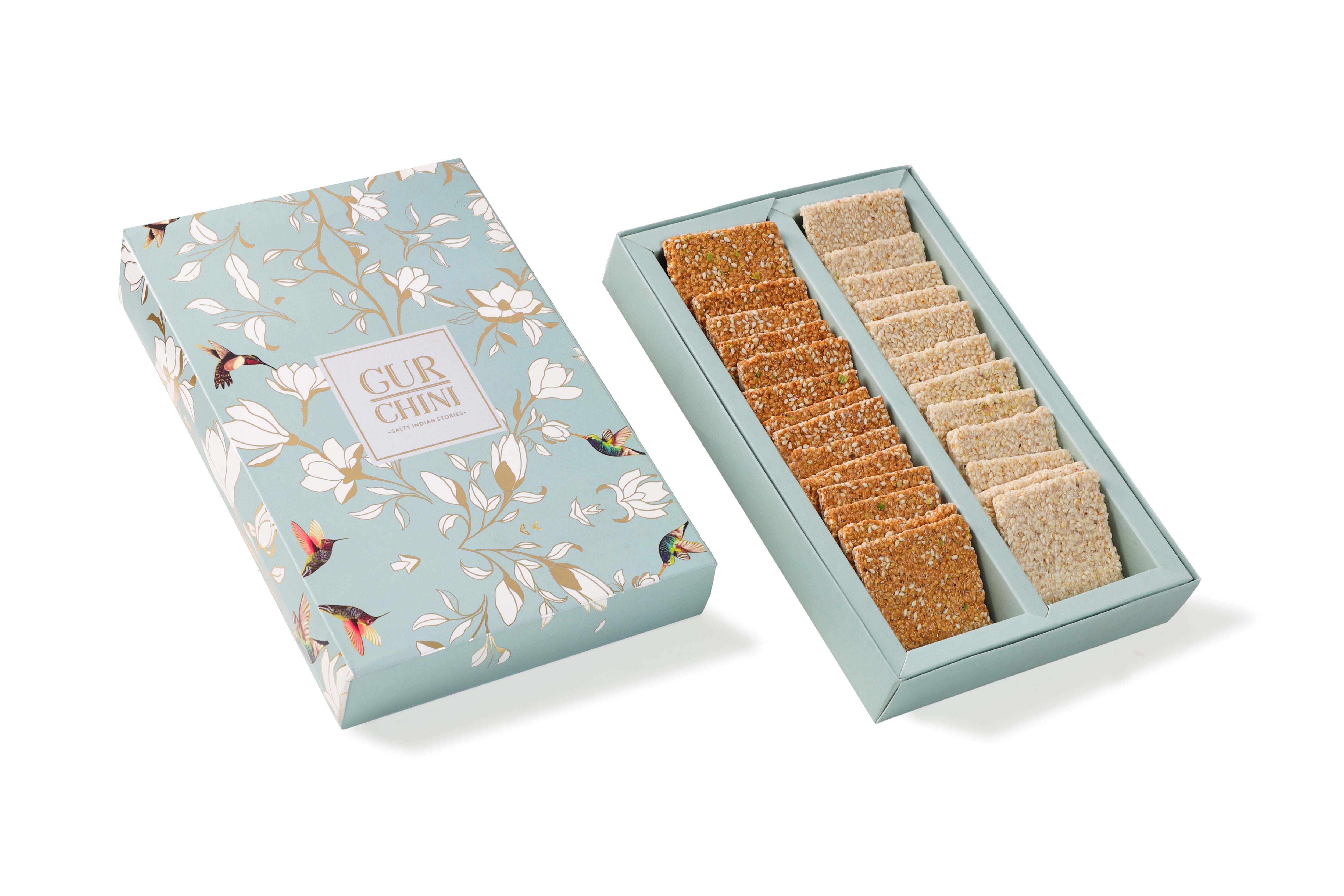 A Sky Blue Flower Box of Chini Till Patti & Til Gur Patti.