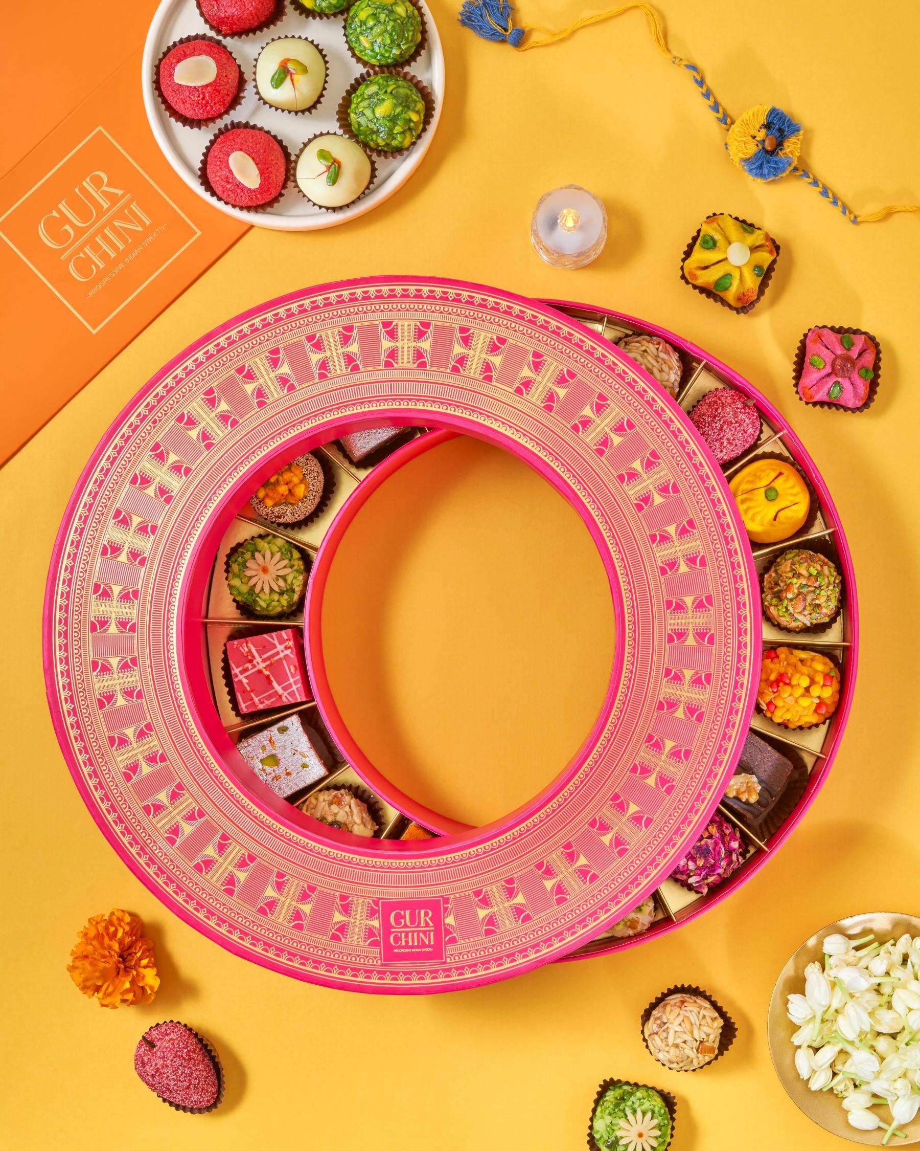 Rakhi Celebration Luxury Pink - Magenta Round Assorted Sweets Box of 18 Pcs